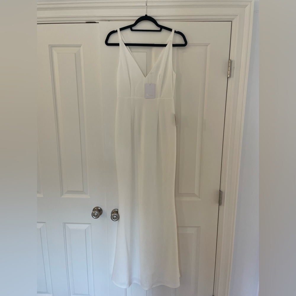 Lulu’s Simple Mermaid style wedding gown. New with tags, size small.